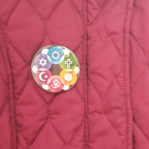 Interfaith Design Button on coat