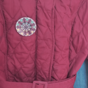 Purple Nine Pointed Star Bahai Button on coat