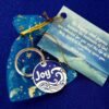 Sea of Joy medallion in cheerful moon and star organza pouch