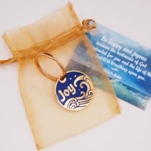 Sea of Joy Gold-plated keyring comes in an organza pouch with a gift card